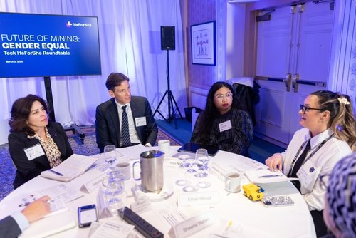 Roundtable discussion at Gender Equal mining event with four participants.